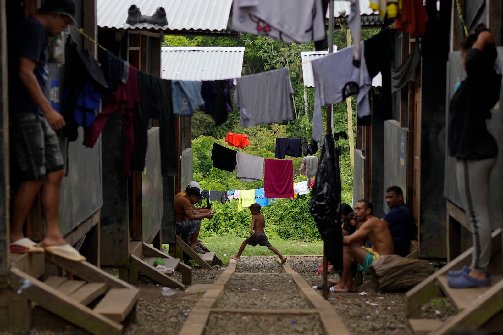 Migrants rest at a camp after treking across the Darien Gap from Colombia in hopes of reaching the U.S., in Lajas Blancas, Panama, Thursday, Sept. 26, 2024. (AP Photo/Matias Delacroix)