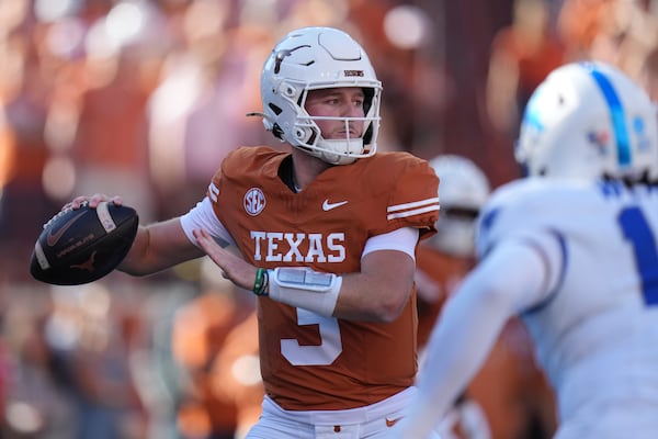 Texas quarterback Quinn Ewers (3) looks to pass against Kentucky during the first half of an NCAA college football game in Austin, Texas, Saturday, Nov. 23, 2024. (AP Photo/Eric Gay)