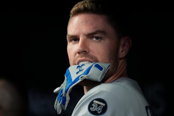 Los Angeles Dodgers' Freddie Freeman (5) prepares to head to the plate in the first inning of a baseball game against the Atlanta Braves, Saturday, May 3, 2025, in Atlanta. (AP Photo/Mike Stewart)