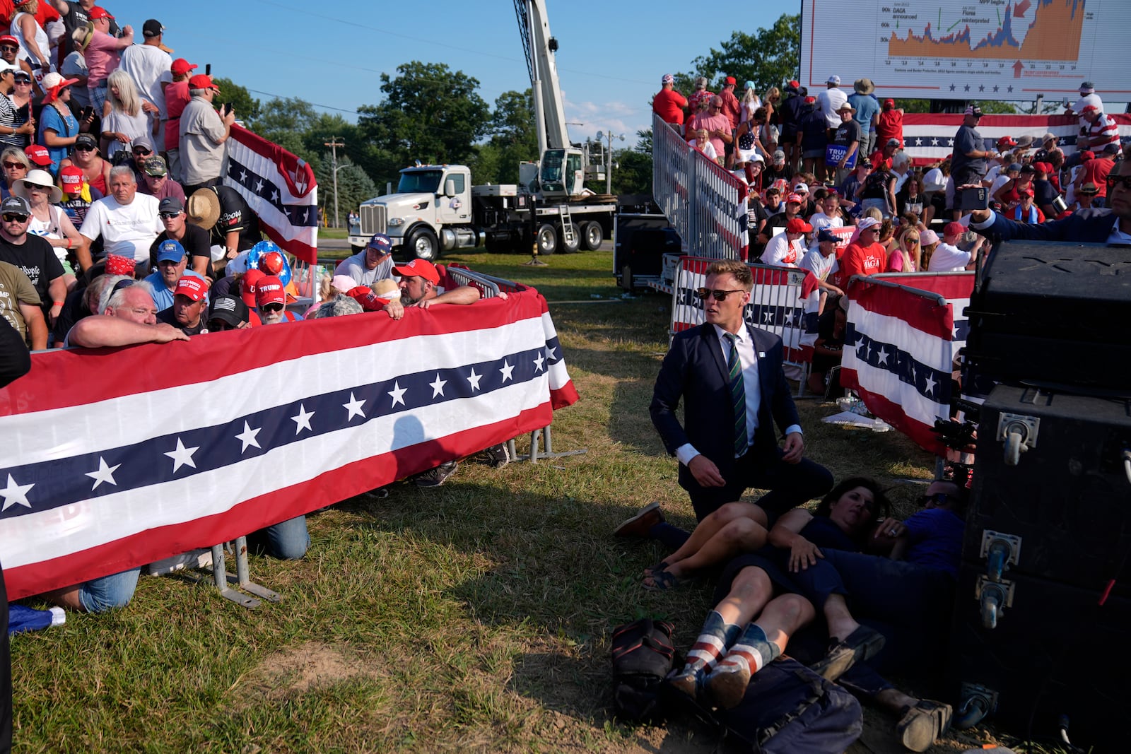 FILE - People react during a campaign rally with Republican presidential candidate former President Donald Trump at a campaign rally, July 13, 2024, in Butler, Pa. (AP Photo/Evan Vucci, File)