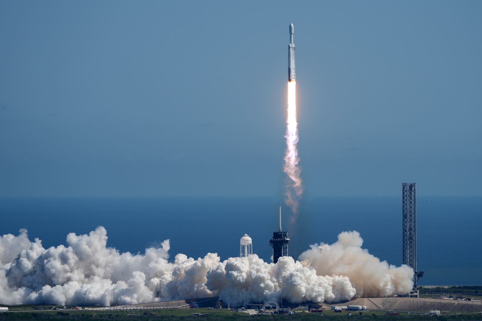 A SpaceX Falcon Heavy rocket with a NASA spacecraft bound for Jupiter lifts off from pad 39A at the Kennedy Space Center Monday, Oct. 14, 2024 in Cape Canaveral, Fla. (AP Photo/John Raoux)