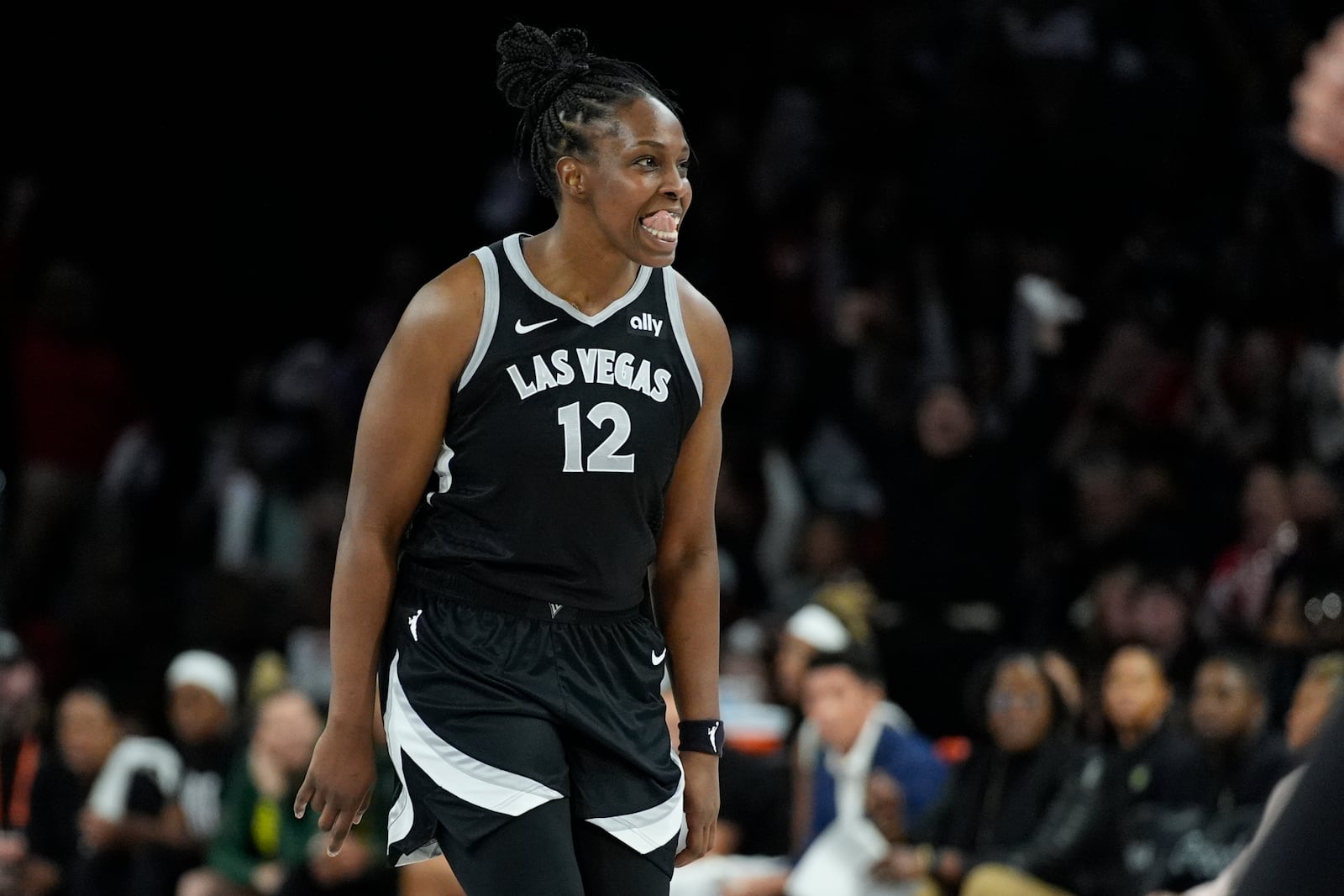 Las Vegas Aces guard Chelsea Gray (12) celebrates after making a 3-point shot against the Seattle Storm during the second half in Game 2 of a WNBA basketball first-round playoff game Tuesday, Sept. 24, 2024, in Las Vegas. (AP Photo/John Locher)