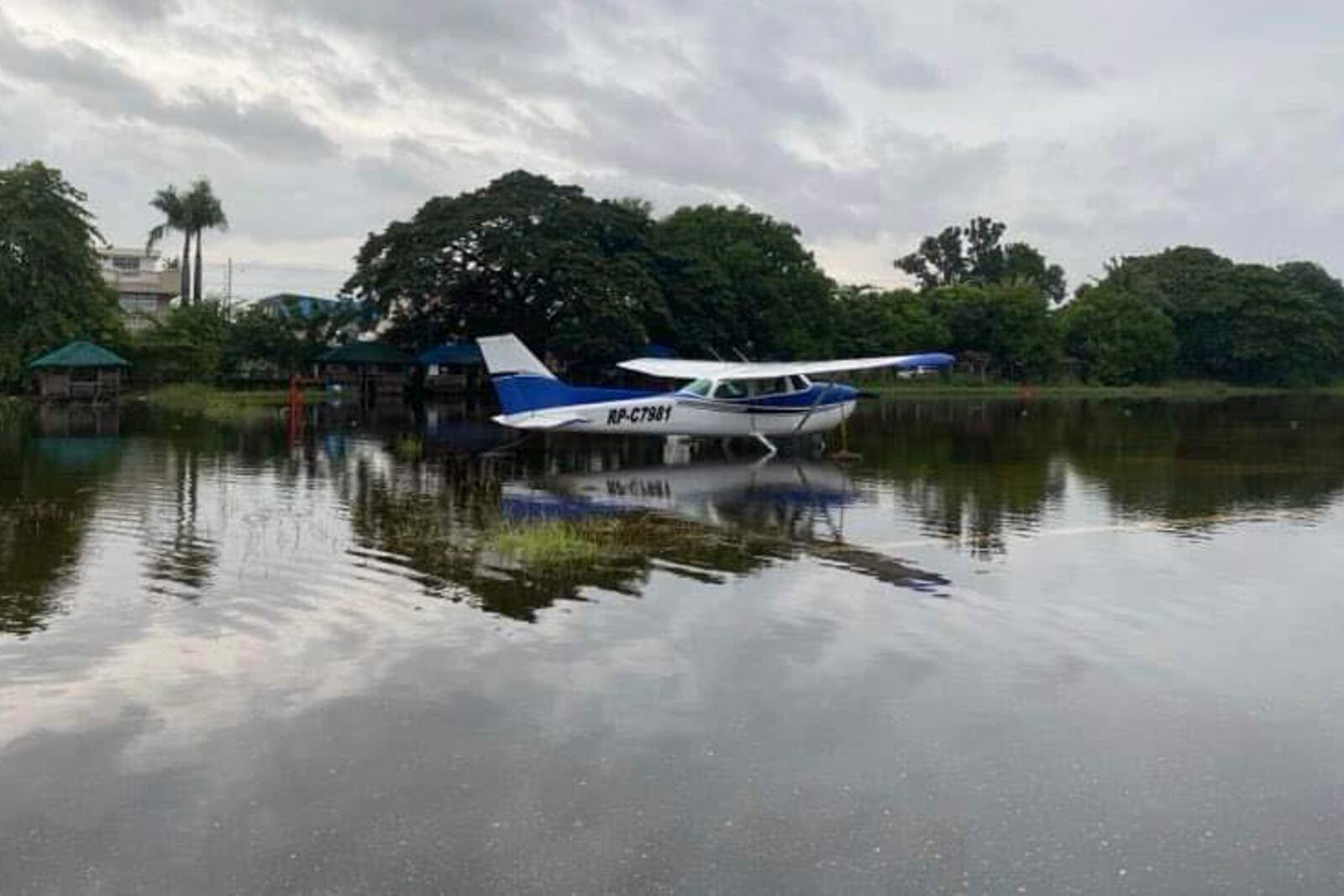 In this photo provided by the Civil Aviation Authority of the Philippines, a plane lies on a flooded airport caused by powerful Typhoon Krathon at San Fernando, La Union province, northern Philippines Monday, Sept. 30, 2024. (Civil Aviation Authority of the Philippines via AP)