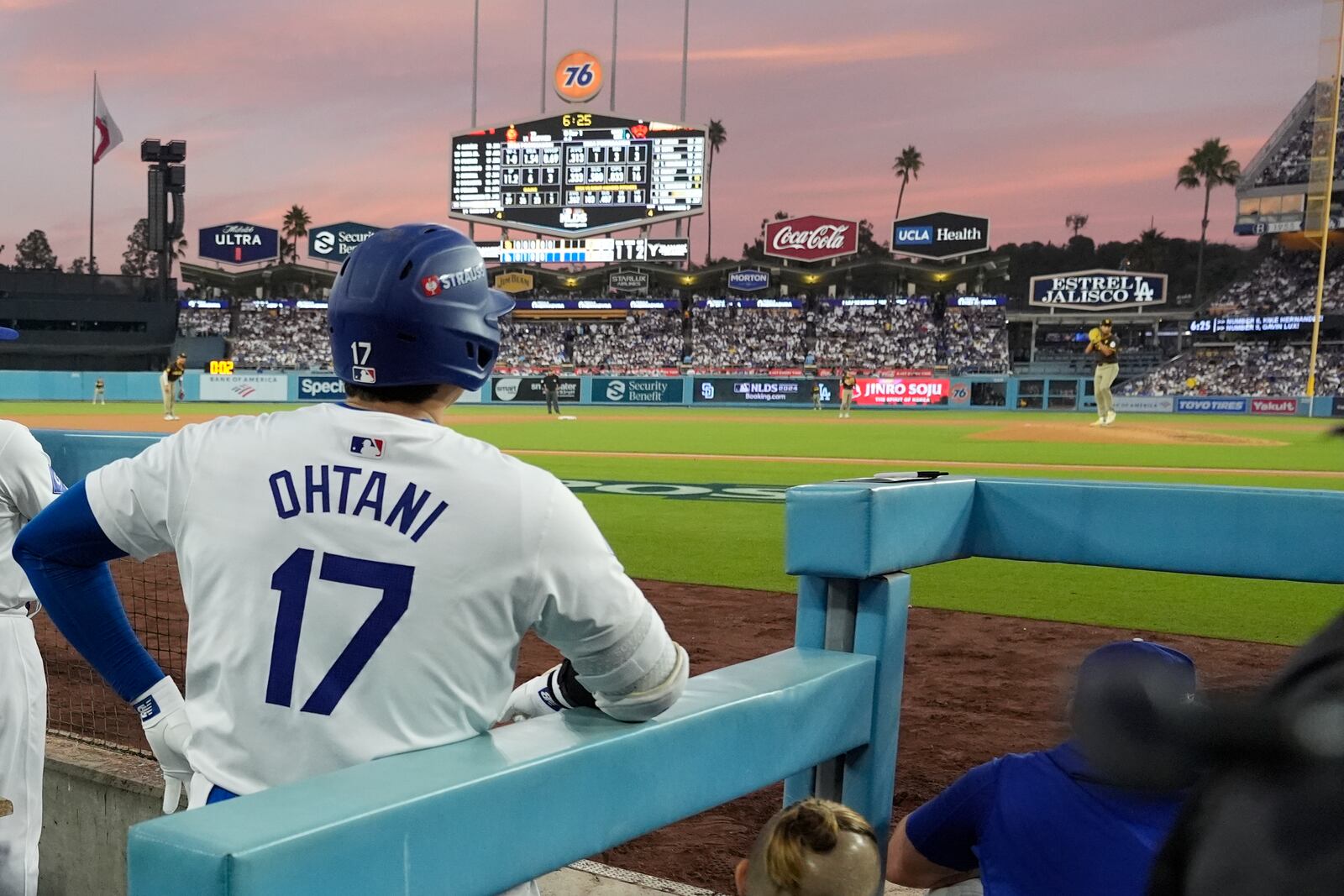 Los Angeles Dodgers' Shohei Ohtani (17) waits to bat as San Diego Padres starting pitcher Yu Darvish, right, throws during the fifth inning in Game 5 of a baseball NL Division Series against the San Diego Padres, Friday, Oct. 11, 2024, in Los Angeles. (AP Photo/Ashley Landis)