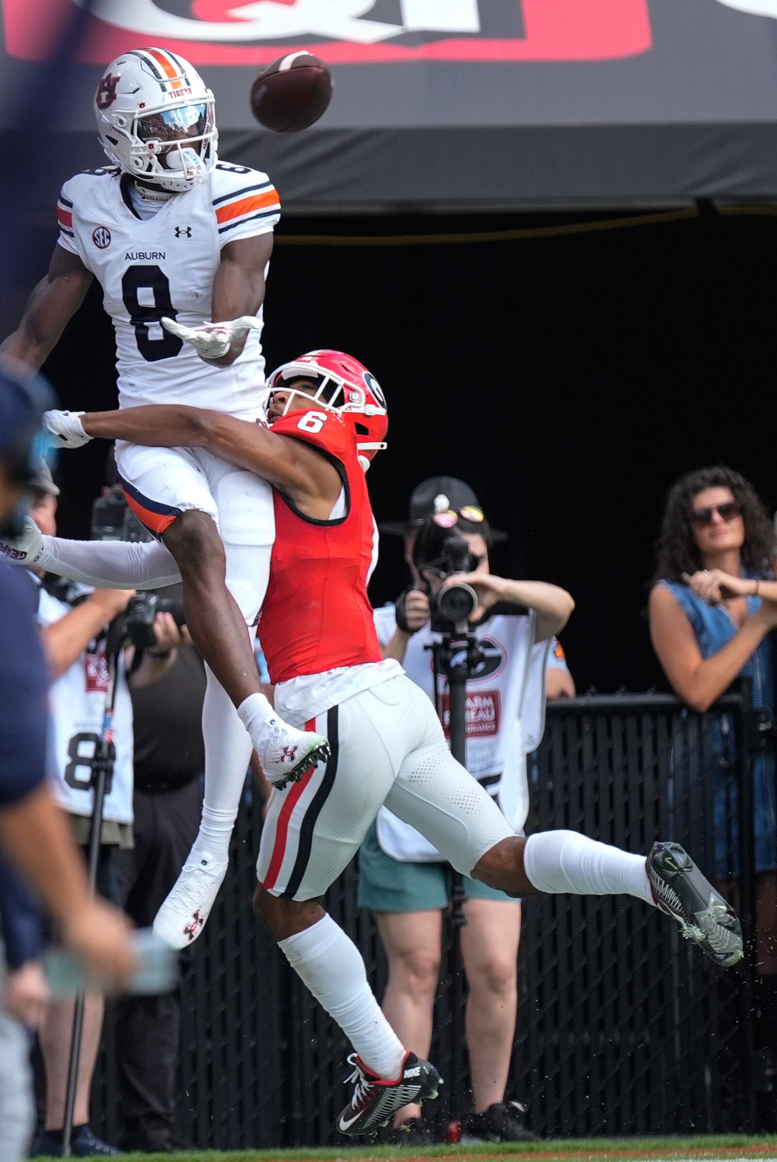 Auburn wide receiver Cam Coleman (8) cana't make a catch as Georgia defensive back Daylen Everette (6) defends in the first half of an NCAA college football game Saturday, Oct. 5, 2024, in Athens, Ga. (AP Photo/John Bazemore)