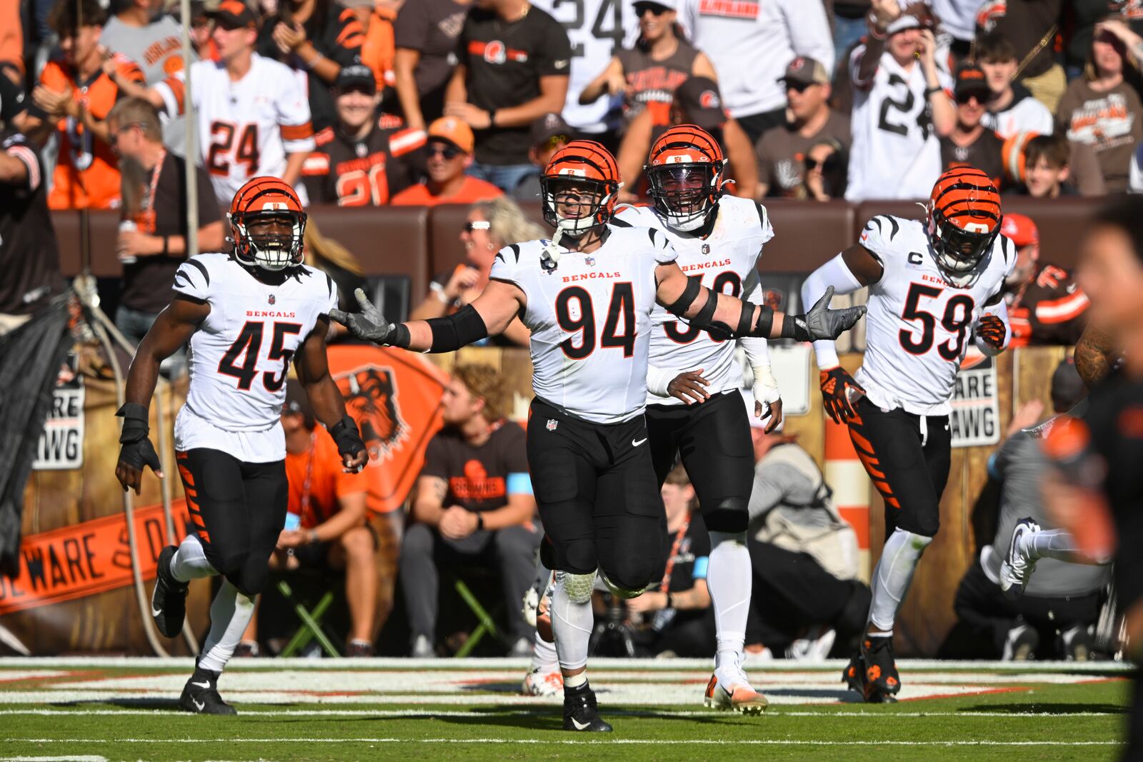 Cincinnati Bengals defensive end Sam Hubbard (94) celebrates his interception in the second half of an NFL football game against the Cleveland Browns, Sunday, Oct. 20, 2024, in Cleveland. (AP Photo/David Richard)