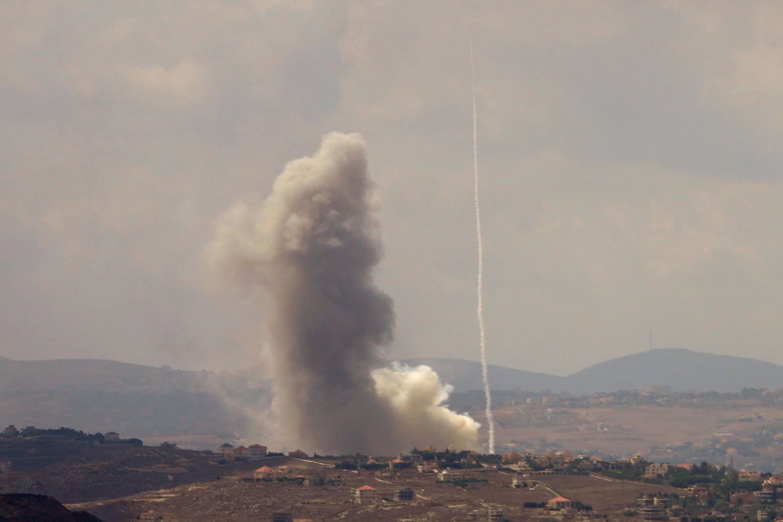 Smoke rises from Israeli airstrikes on Taybeh village, seen from the southern town of Marjayoun, Lebanon, Monday, Sept. 23, 2024. (AP Photo/Hussein Malla)