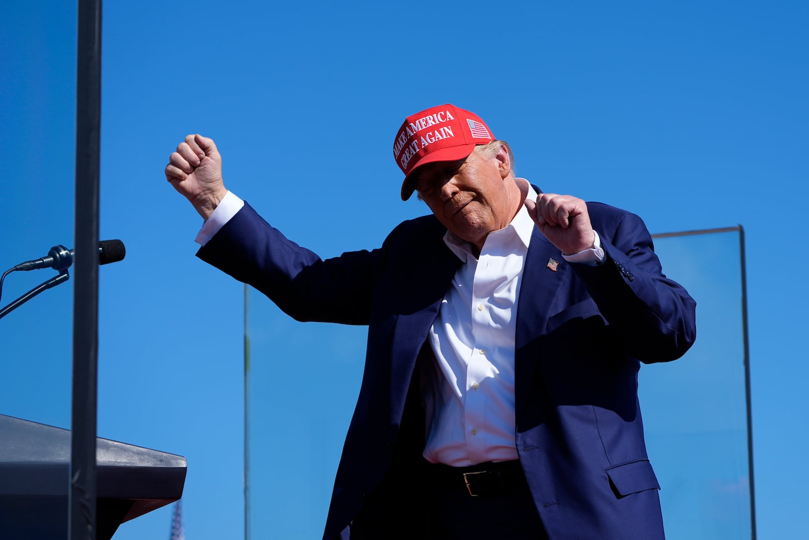 Republican presidential nominee former President Donald Trump dances after speaking at a campaign rally at Wilmington International Airport, Saturday, Sept. 21, 2024, in Wilmington, N.C. (AP Photo/Alex Brandon)