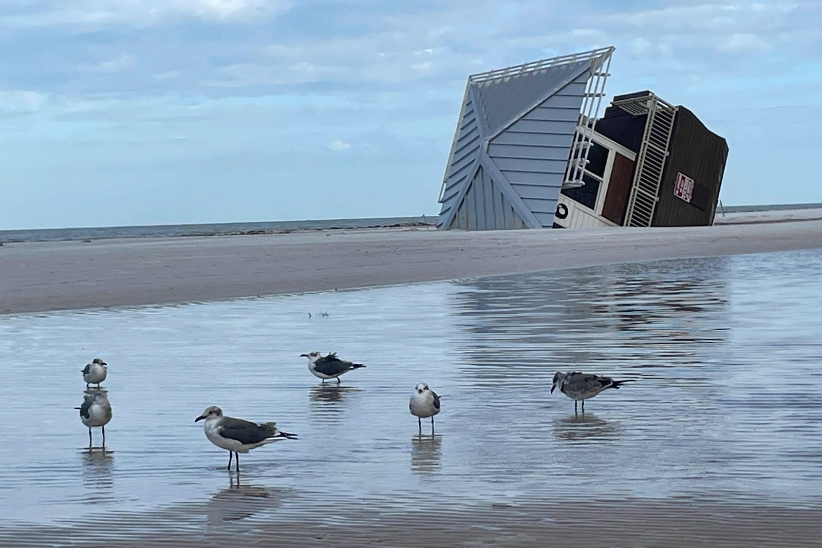 A lifeguard hut is on its side after Hurricane Milton at Clearwater Beach, Fla., on Friday, Oct. 11, 2024 (AP Photo/Haven Daley)