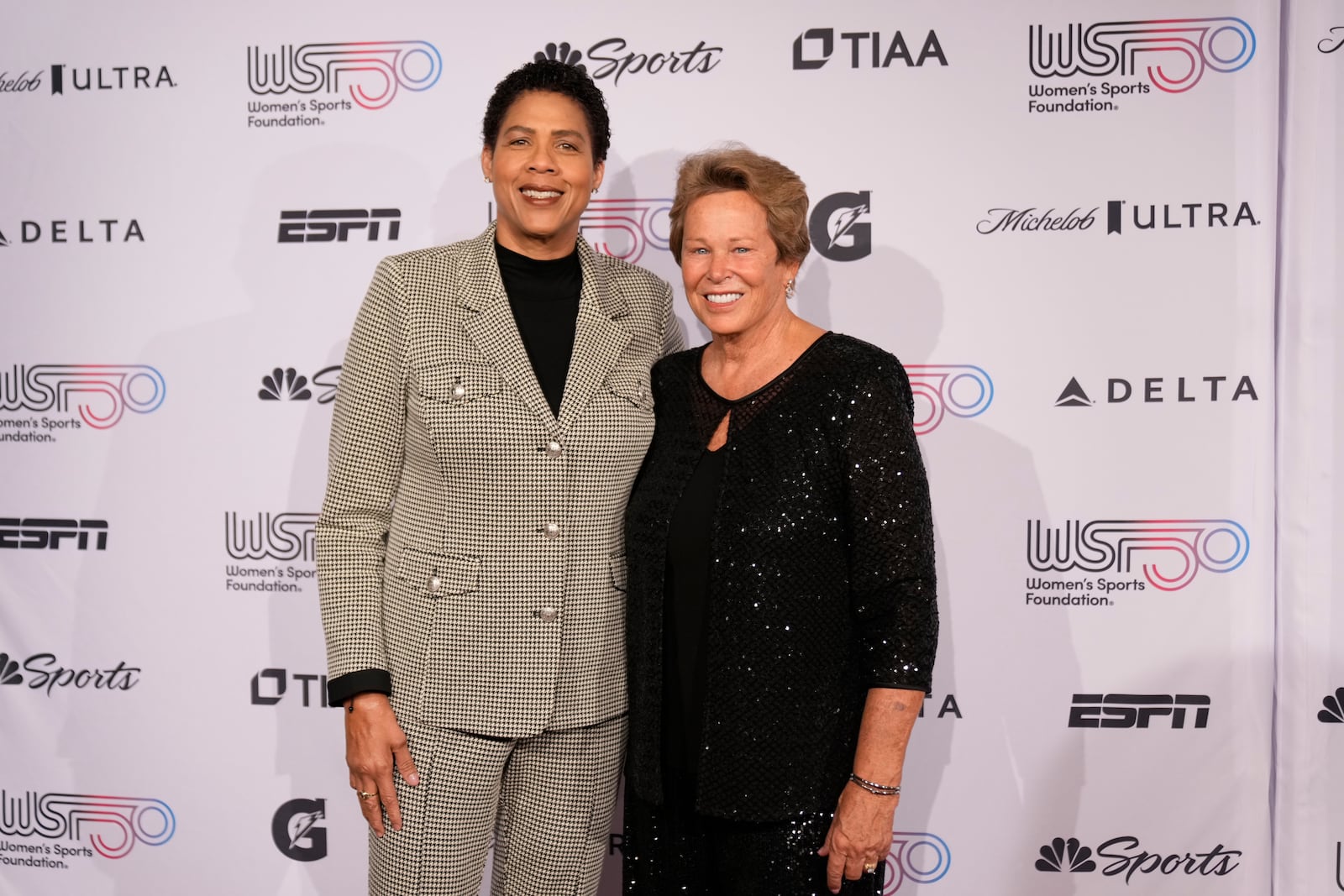 Cheryl Miller, left, and Ann Myers Drysdale, right, pose for photos on the red carpet at the Women's Sports Foundation's Annual Salute to Women in Sports, Wednesday, Oct. 16, 2024, in New York. (AP Photo/Pamela Smith)