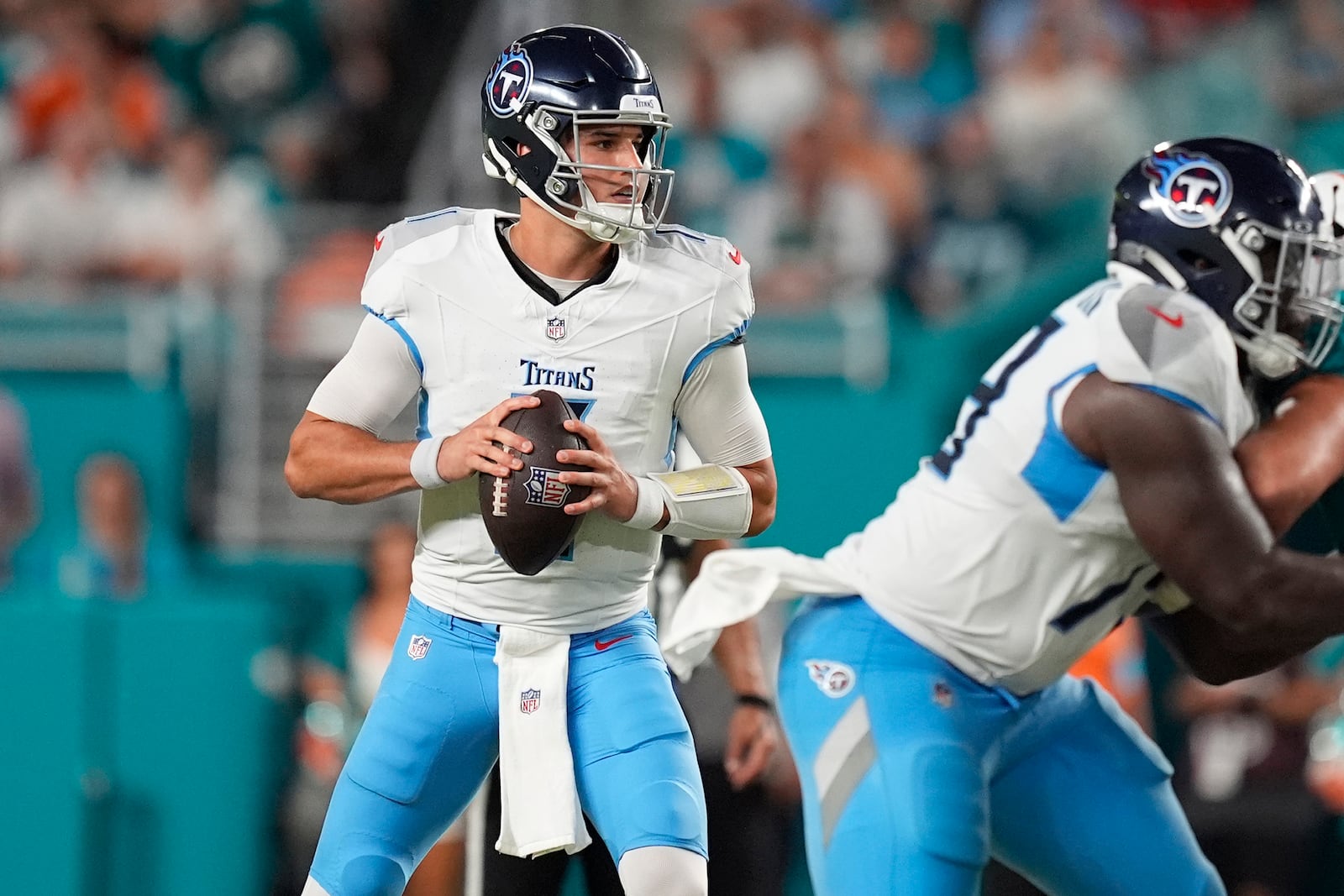 Tennessee Titans quarterback Mason Rudolph (11) aims a pass during the first half of an NFL football game against the Miami Dolphins, Monday, Sept. 30, 2024, in Miami Gardens, Fla. (AP Photo/Rebecca Blackwell)