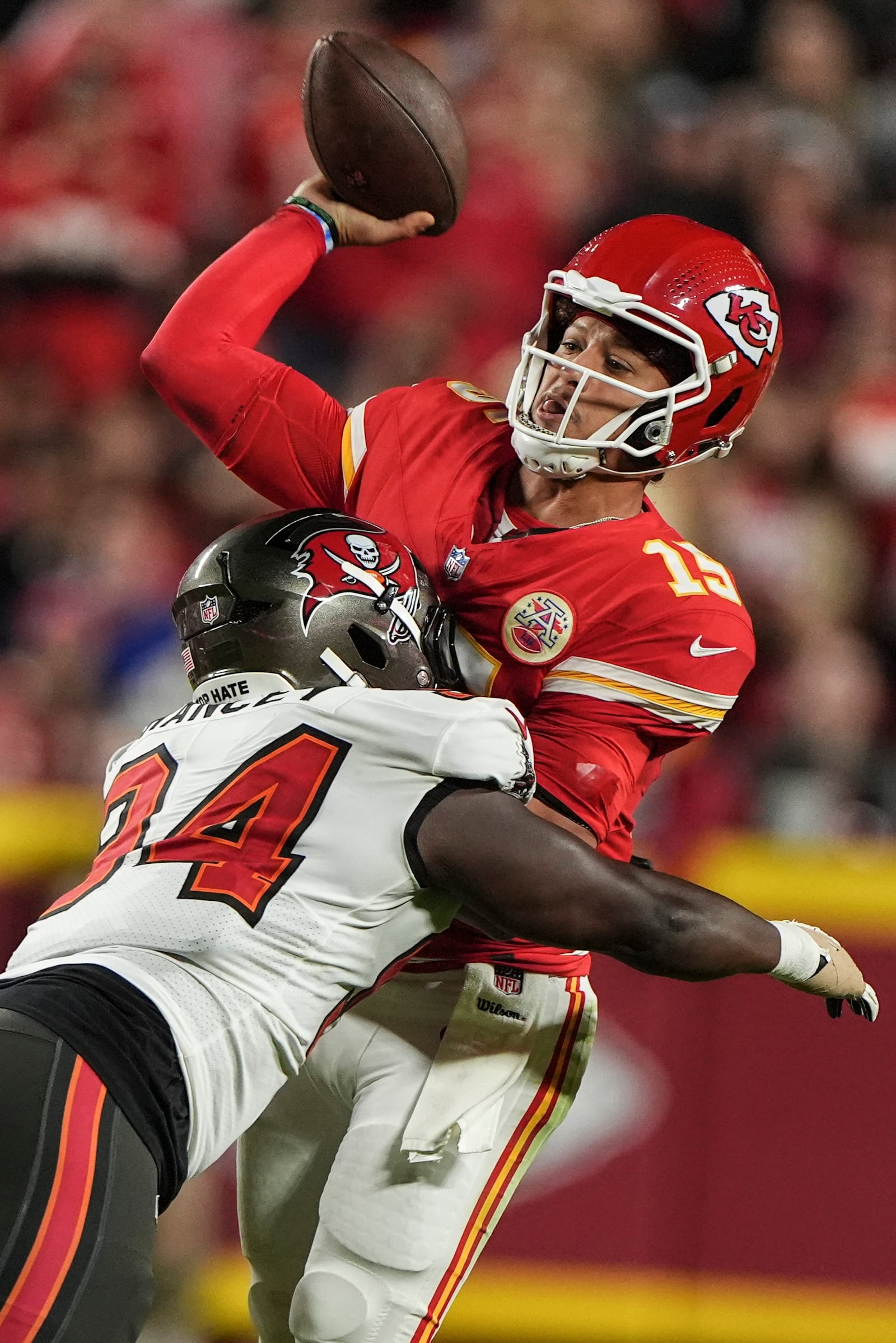 Tampa Bay Buccaneers cornerback Bryce Hall (34) hits Kansas City Chiefs quarterback Patrick Mahomes (15) during the first half of an NFL football game, Monday, Nov. 4, 2024, in Kansas City, Mo. (AP Photo/Charlie Riedel)