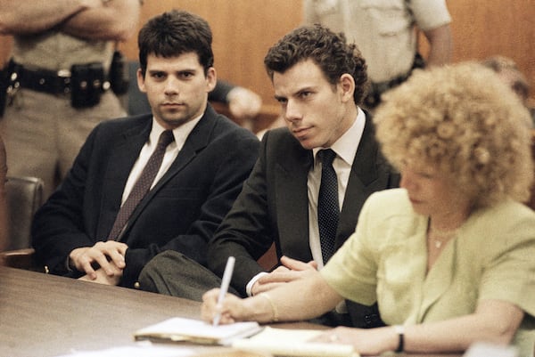 FILE - Lyle, left, and Erik Galen Menendez sit in Beverly Hills, Calif., courtroom, May 14, 1990 as a judge postponed their preliminary hearing on charges of murdering their parents last August. (AP Photo/Kevork Djansezian, File)