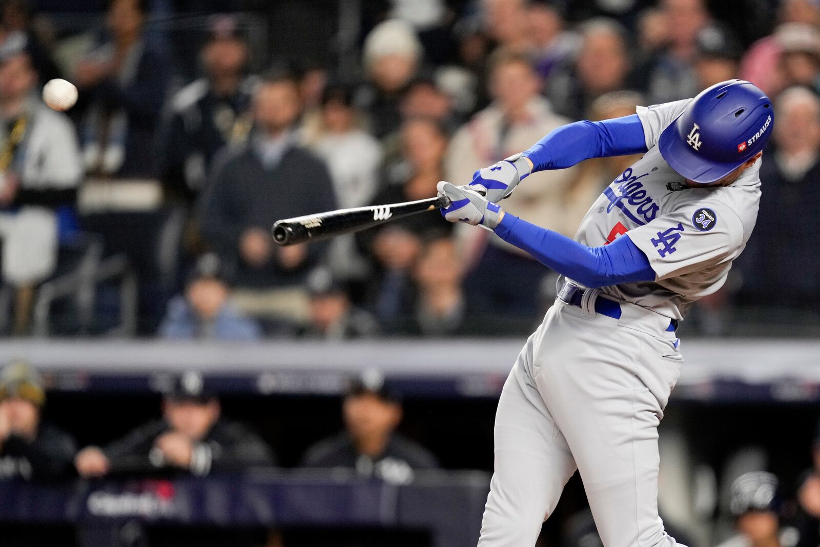 Los Angeles Dodgers' Freddie Freeman hits a two-run home run against the New York Yankees during the first inning in Game 3 of the baseball World Series, Monday, Oct. 28, 2024, in New York. (AP Photo/Ashley Landis)