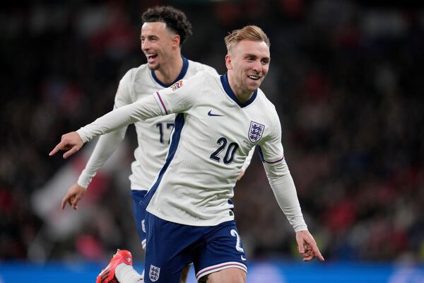 England's Jarrod Bowen celebrates England's Curtis Jones, background, after scoring his side's fourth goal during the UEFA Nations League soccer match between England and the Republic of Ireland at Wembley stadium in London, Sunday, Nov. 17, 2024. (AP Photo/Kin Cheung)