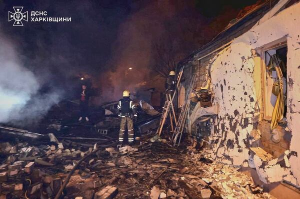In this photo provided by the Ukrainian Emergency Service, emergency services personnel work to extinguish a fire following a Russian attack in Kharkiv, Ukraine, Saturday, May 3, 2025. (Ukrainian Emergency Service via AP)