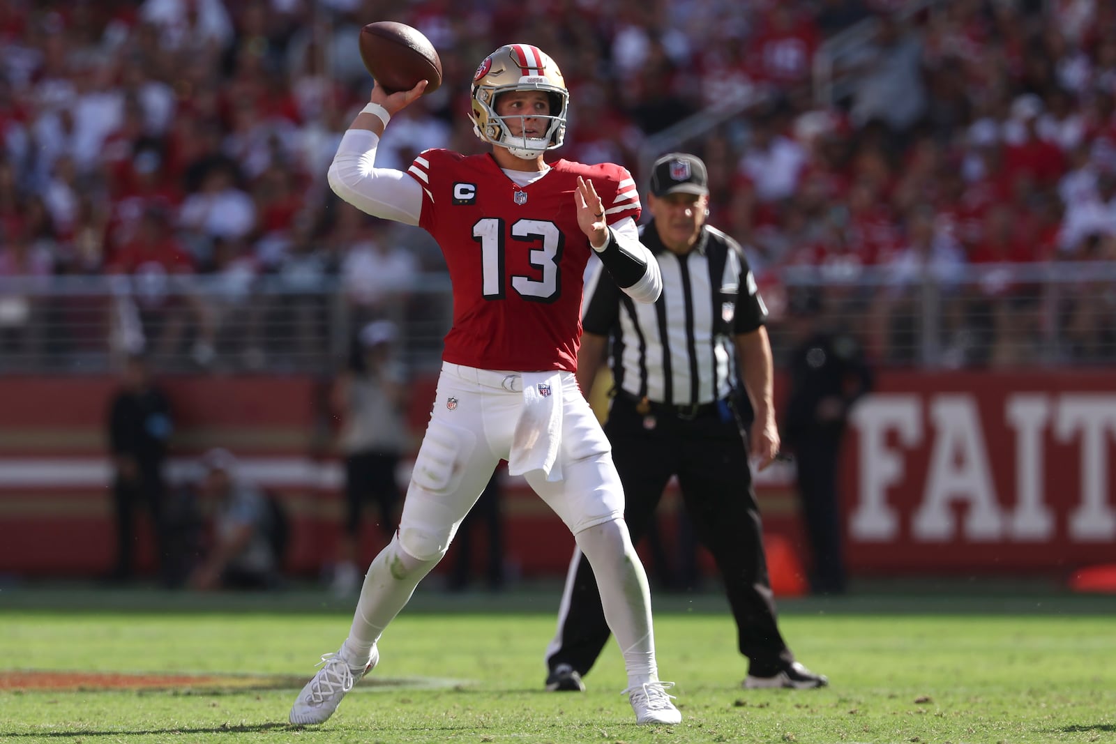 San Francisco 49ers quarterback Brock Purdy (13) passes against the Arizona Cardinals during the second half of an NFL football game in Santa Clara, Calif., Sunday, Oct. 6, 2024. (AP Photo/Jed Jacobsohn)