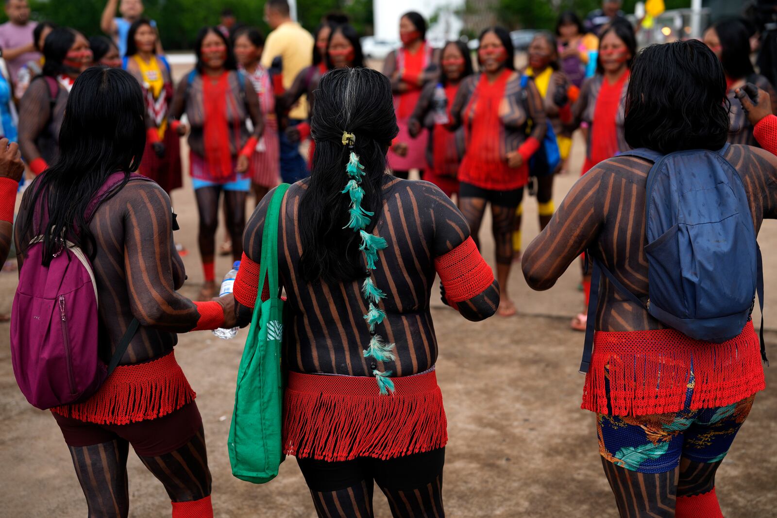 Indigenous groups take part in protest against the prospective creation of a benchmark time limit that threatens to strip some of their lands, in Brasilia, Brazil, Wednesday, Oct. 30, 2024. (AP Photo/Eraldo Peres)