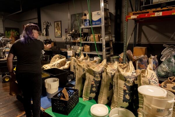 Renee Colon, co-owner of Fuego Coffee Roasters, works at her roasting facility Friday, March 21, 2025, in Rochester, N.Y. (Max Conway via AP)