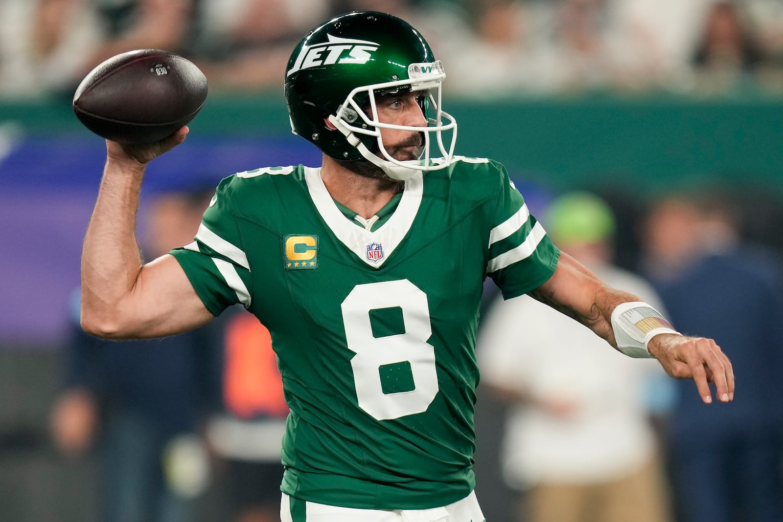 New York Jets quarterback Aaron Rodgers (8) passes against the New England Patriots during the first quarter of an NFL football game, Thursday, Sept. 19, 2024, in East Rutherford, N.J. (AP Photo/Seth Wenig)