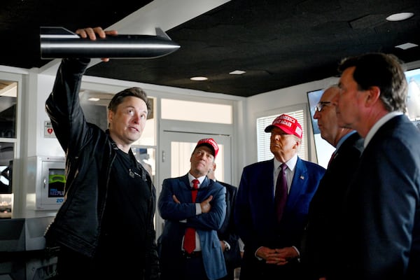 President-elect Donald Trump listens as Elon Musk explains the operations ahead of the launch of the sixth test flight of the SpaceX Starship rocket Tuesday, Nov. 19, 2024 in Brownsville, Texas. (Brandon Bell/Pool via AP)