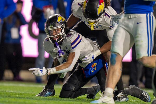 Kansas wide receiver Quentin Skinner looks at the official after recovering a fumble on a BYU punt in an NCAA college football game Saturday, Nov. 16, 2024, in Provo. (AP Photo/Rick Egan)