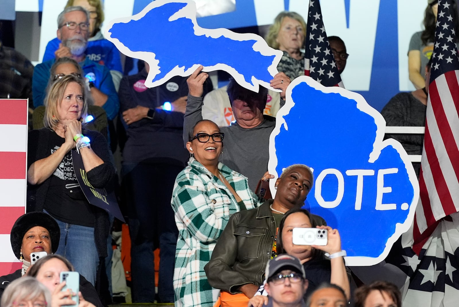 Supporters listen as democratic presidential nominee Vice President Kamala Harris speaks during a campaign rally at the Wings Event Center in Kalamazoo, Mich. (AP Photo/Jacquelyn Martin)