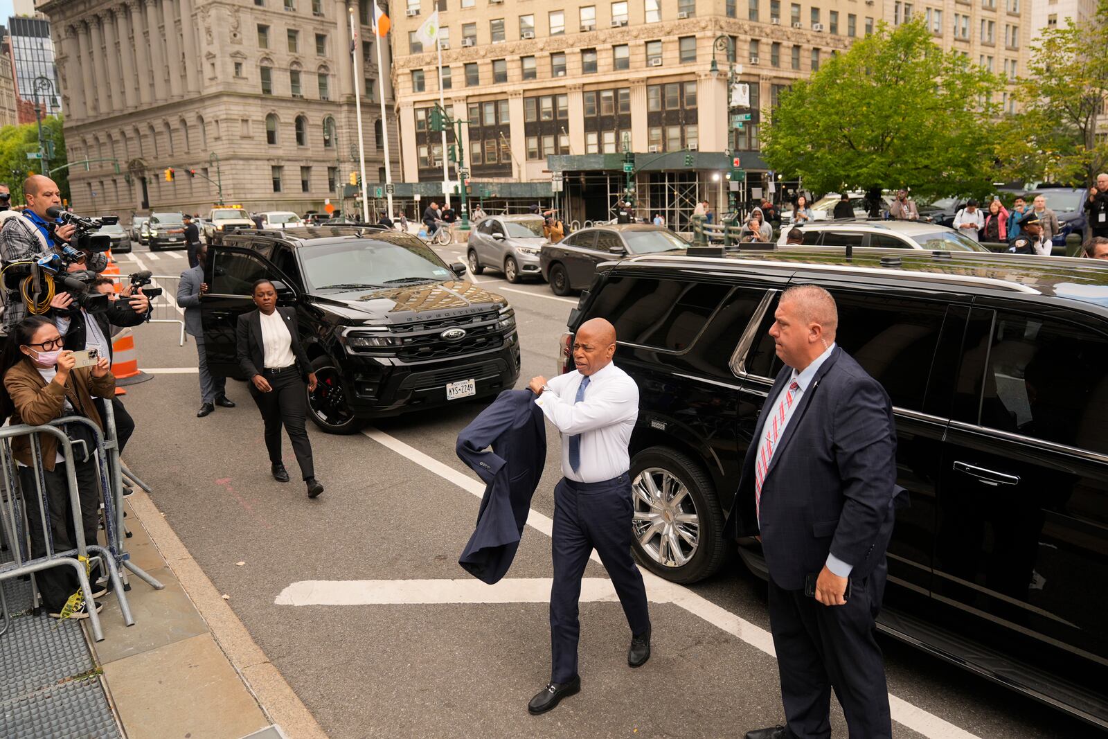 New York City Mayor Eric Adams, second from right, arrives to court in New York, Wednesday, Oct. 2, 2024. (AP Photo/Seth Wenig)