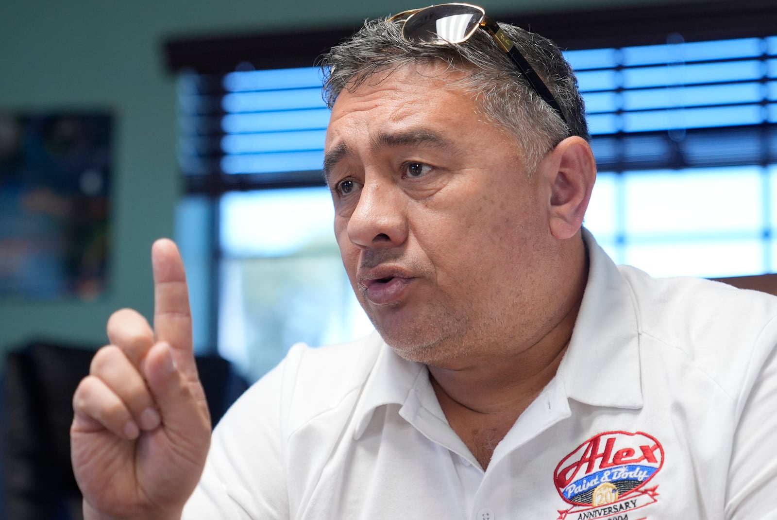 Alex Salguero talks about the 2024 presidential election during an interview at his business in Lewisville, Texas, Wednesday, Oct. 2, 2024. (AP Photo/LM Otero)