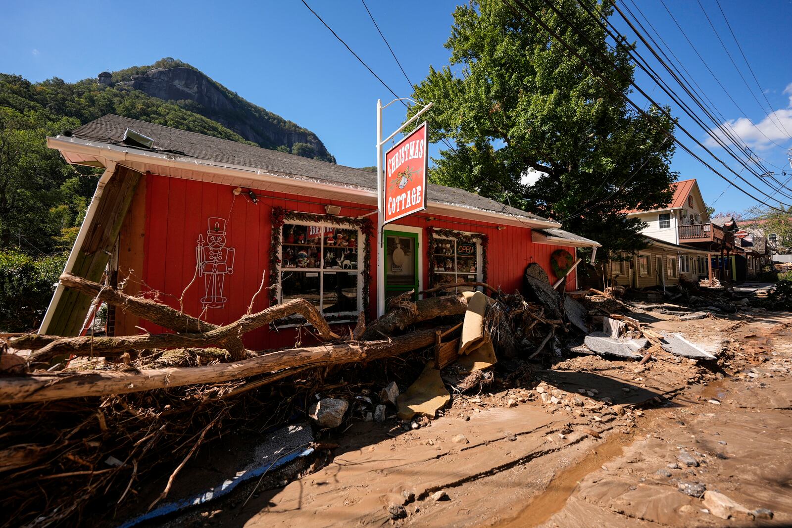 Business are seen in a debris field in the aftermath of Hurricane Helene, Wednesday, Oct. 2, 2024, in Chimney Rock Village, N.C. (AP Photo/Mike Stewart)