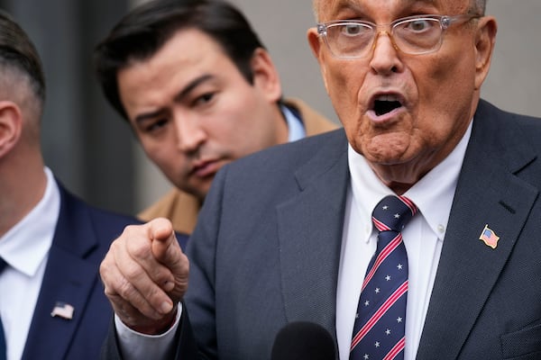 Rudy Giuliani speaks to reporters as he leaves the federal courthouse in New York, Tuesday, Nov. 26, 2024. (AP Photo/Seth Wenig)