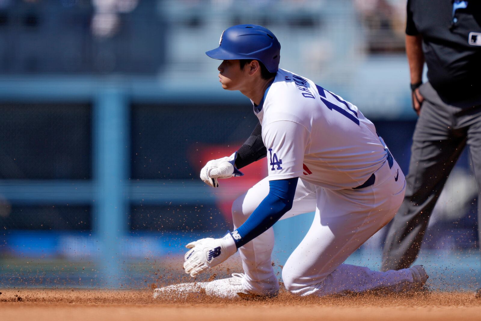 Los Angeles Dodgers' Shohei Ohtani steals second during the third inning of a baseball game against the Colorado Rockies, Sunday, Sept. 22, 2024, in Los Angeles. (AP Photo/Mark J. Terrill)