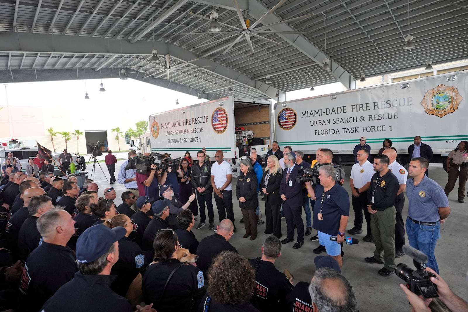 Miami-Dade County Mayor Daniella Levine Cava, center, addresses members of Miami-Dade Fire Rescue's Urban Search and Rescue Florida Task Force One before they deploy ahead of Hurricane Milton, Wednesday, Oct. 9, 2024, in Doral, Fla. (AP Photo/Wilfredo Lee)