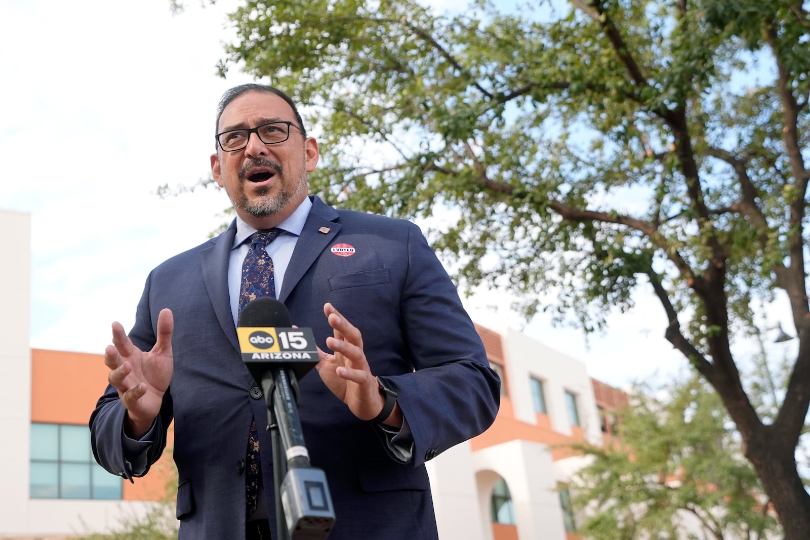 Adrian Fontes, Arizona Secretary of State, speaks during a news conference after voting on the first day of early in-person voting for the general election at Surprise City Hall Wednesday, Oct. 9, 2024, in Surprise, Ariz. (AP Photo/Ross D. Franklin)