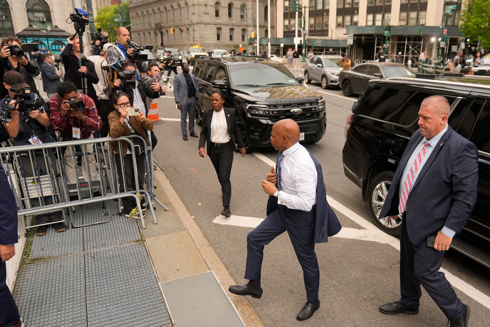 New York City Mayor Eric Adams, second from right, arrives to court in New York, Wednesday, Oct. 2, 2024. (AP Photo/Seth Wenig)