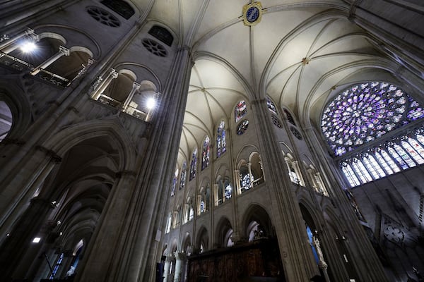 The South Rose stainglass window of Notre-Dame de Paris cathedral is seen while French President Emmanuel Macron visits the restored interiors of the cathedral, Friday Nov. 29, 2024, in Paris. (Stephane de Sakutin, Pool via AP)