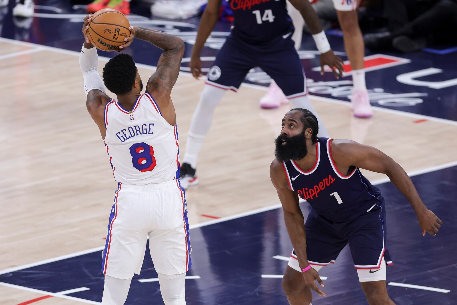 Philadelphia 76ers forward Paul George (8) shoots against Los Angeles Clippers guard James Harden (1) during the first half of an NBA basketball game, Wednesday, Nov. 6, 2024, in Inglewood, Calif. (AP Photo/Ryan Sun)