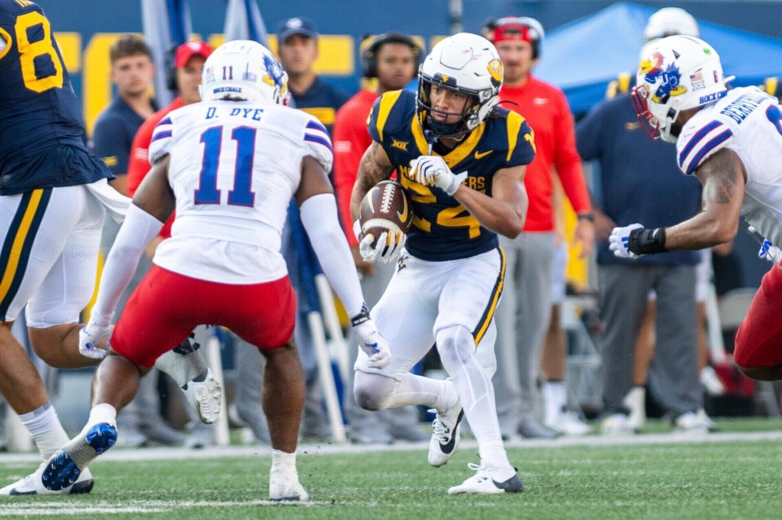 West Virginia's Rodney Gallagher III (24) runs the ball down the side of the field against Kansas during an NCAA college football game Saturday, Sept. 21, 2024, in Morgantown, W.Va. (Benjamin Powell/The Dominion-Post via AP)