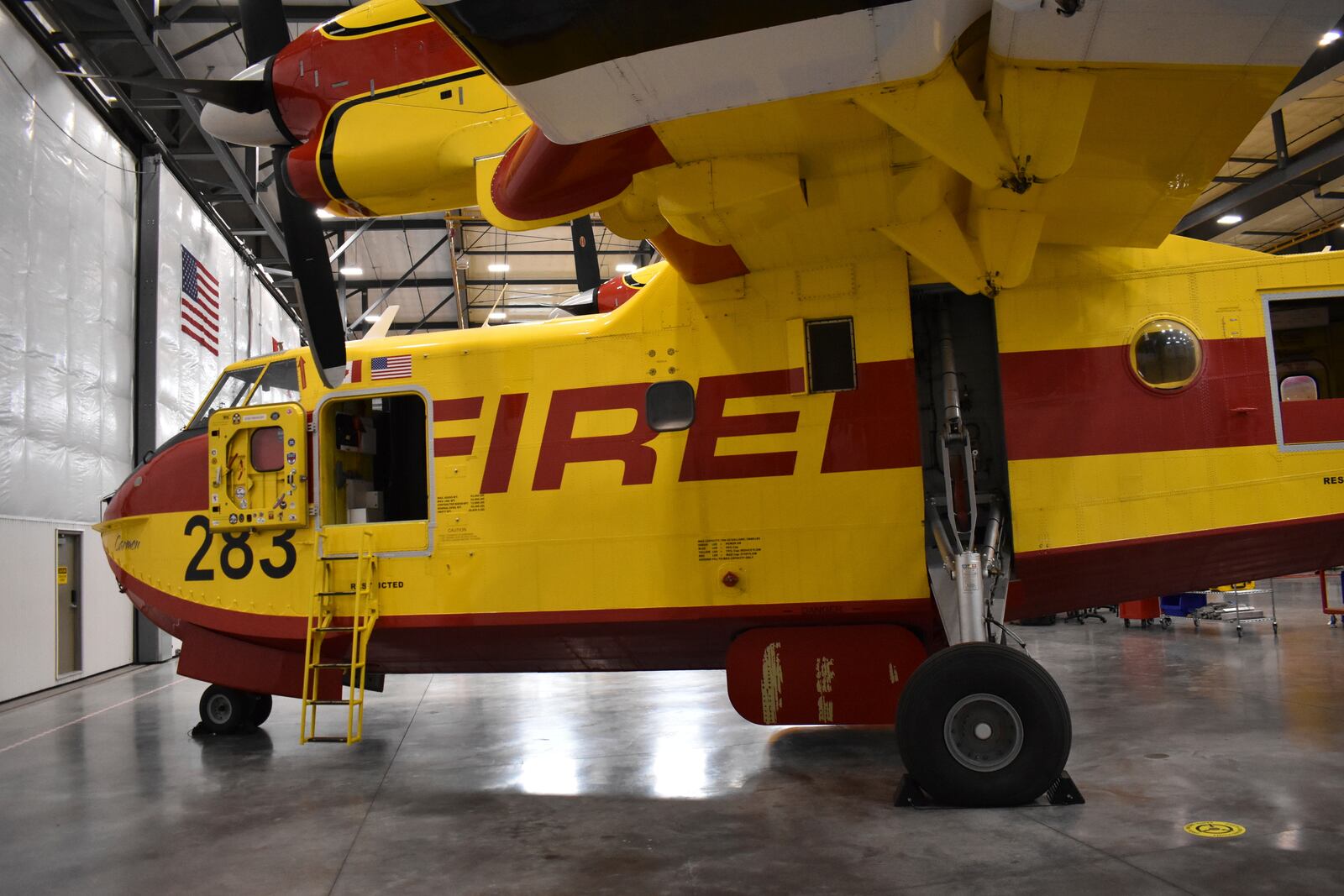 A firefighting aircraft known as a "Super Scooper" is seen inside a Bridger Aerospace hangar at Bozeman Yellowstone International Airport, Oct. 27, 2022, in Belgrade, Mont. (AP Photo/Matthew Brown)