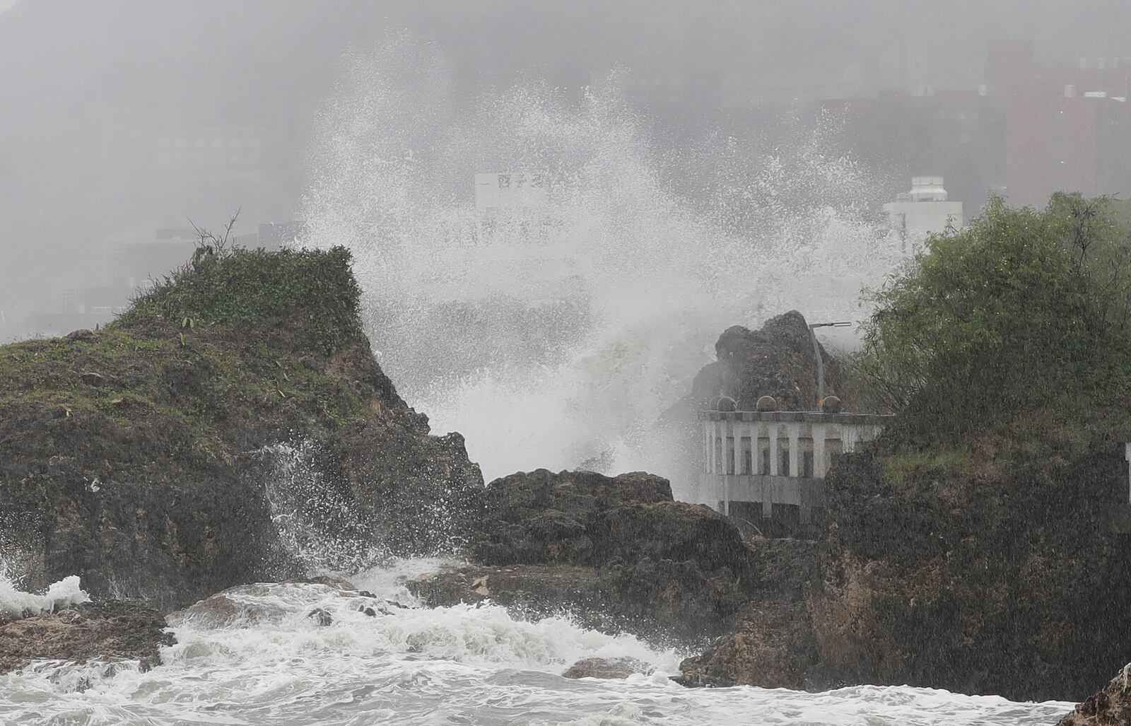 Waves crash on the coastline in Kaohsiung, southern Taiwan, Wednesday, Oct. 2, 2024, as Typhoon Krathon approaches to Taiwan. (AP Photo/Chiang Ying-ying)