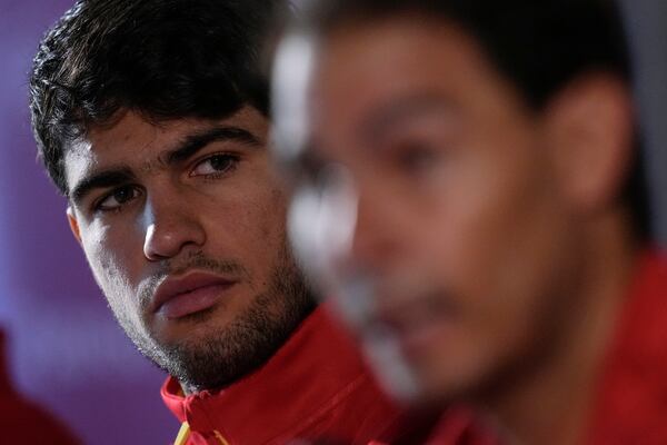 Spain's tennis player Carlos Alcaraz, left, and Rafael Nadal attends a press conference in Fuengirola, southern Spain, on Monday, Nov. 18, 2024. (AP Photo/Manu Fernandez)