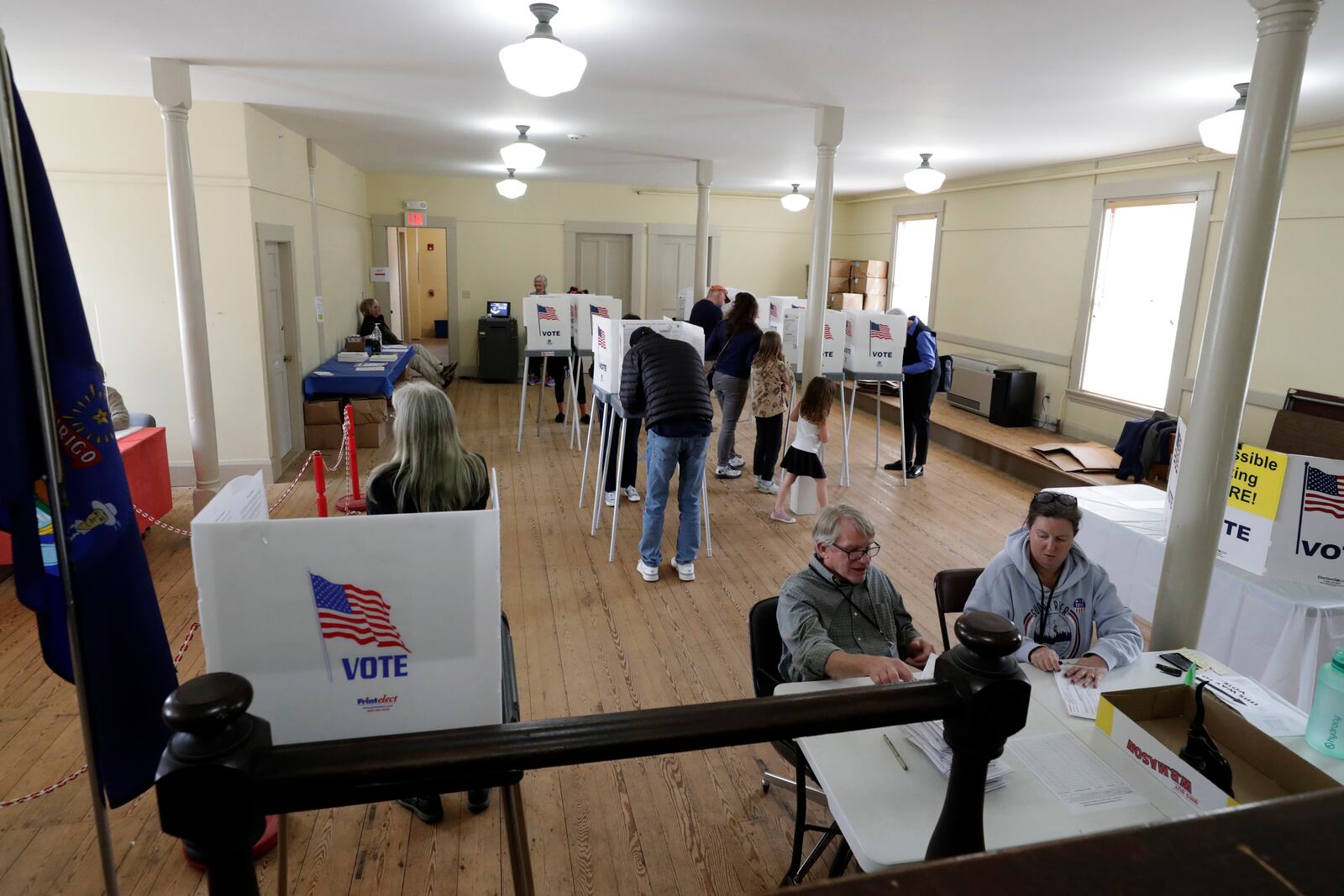 People cast their votes on Election Day, Tuesday, Nov. 5, 2024 in Pownal, Maine. (AP Photo/Joel Page)