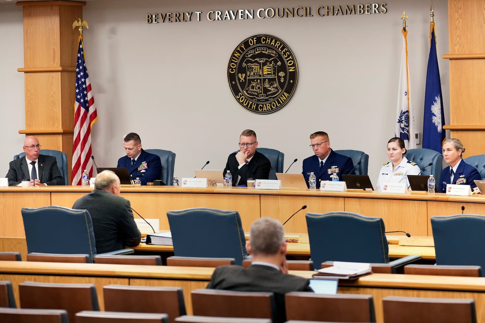 Fred Hagan, seated at left, faces officials while testifying before the Titan marine board of investigation hearing inside the Charleston County Council Chambers, Friday, Sept. 20, 2024, in North Charleston, S.C. (Corey Connor via AP, Pool)