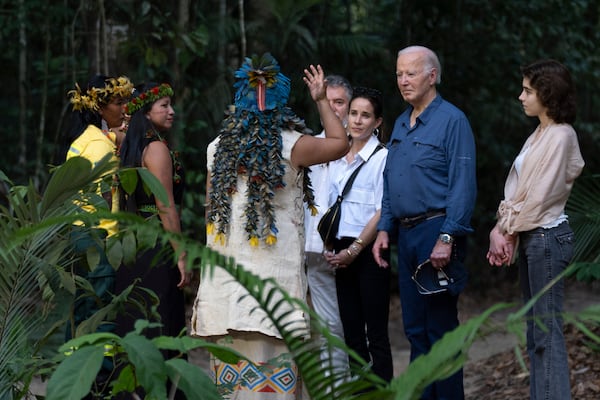 President Joe Biden, second right, joined by daughter Ashley Biden, third from right, and granddaughter Natalie Biden, right, meets with indigenous and other leaders during a tour of the Museu da Amazonia in Manaus, Brazil, Sunday, Nov. 17, 2024. (AP Photo/Manuel Balce Ceneta)