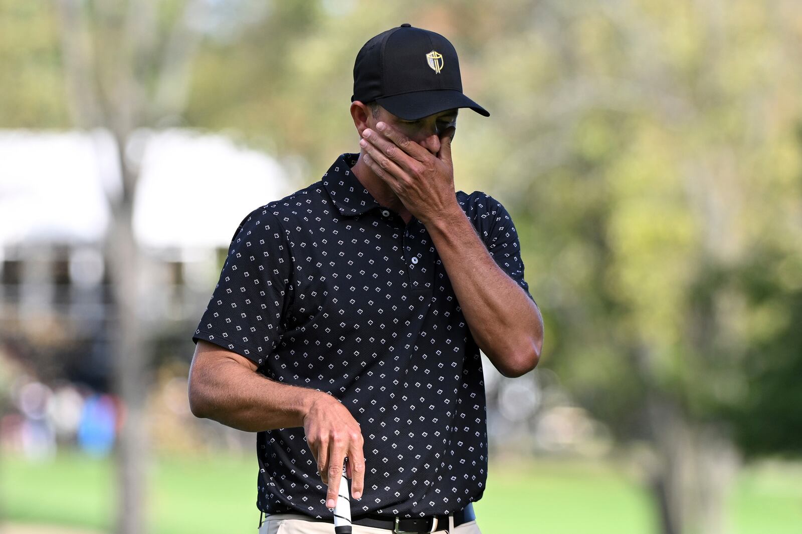 International team member Adam Scott, of Australia, reacts after missing the putt on the 14th green during a first-round four-ball match at the Presidents Cup golf tournament at the Royal Montreal Golf Club in Montreal, Thursday, Sept. 26, 2024. (Graham Hughes/The Canadian Press via AP)