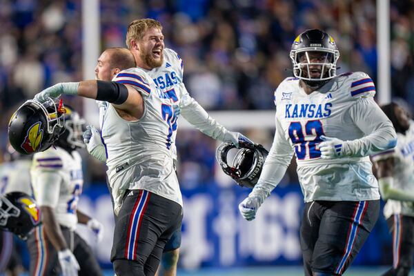 Kansas celebrates their win over BYU at the buzzer during an NCAA college football game Saturday, Nov. 16, 2024, in Provo. (AP Photo/Rick Egan)