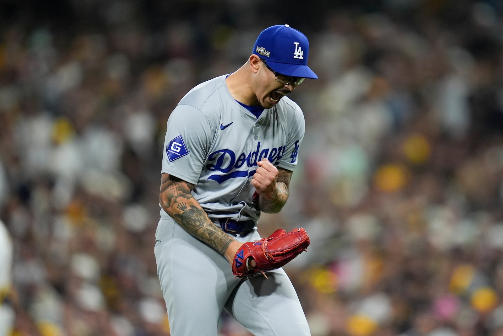 Los Angeles Dodgers pitcher Anthony Banda reacts after the last out of the second inning, on a fly ball by San Diego Padres' Jake Cronenworth, in Game 4 of a baseball NL Division Series Wednesday, Oct. 9, 2024, in San Diego. (AP Photo/Gregory Bull)