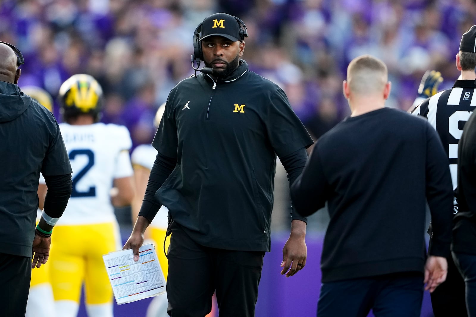 Michigan head coach Sherrone Moore walks on the sideline during the first half of an NCAA college football game against Washington, Saturday, Oct. 5, 2024, in Seattle. (AP Photo/Lindsey Wasson)