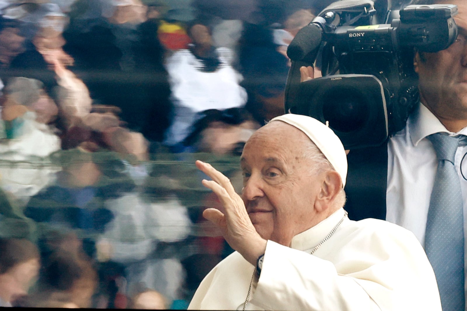 Pope Francis waves as he arrives to lead the holy mass , at the King Baudouin stadium in Brussels, Belgium, Sunday, Sept. 29, 2024. (AP Photo/Omar Havana)