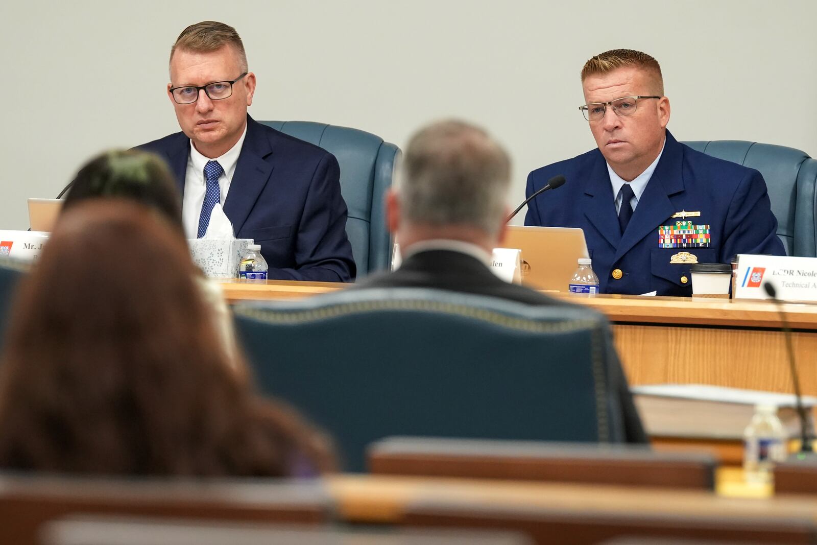 Jason Neubauer, board chairman, left, and Thomas Whalen, board member, right, listen during the Titan marine board formal hearing inside the Charleston County Council Chambers, Thursday, Sept. 19, 2024, in North Charleston, S.C. (Corey Connor via AP, Pool)